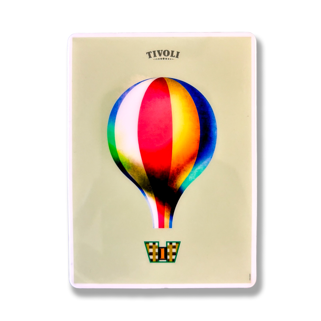 Tivoli magnet med motiv af den ikoniske Tivoli-ballon i røde, blå, gule, grønne og hvide farver. Ballonen svæver over en dekorativ ballonkurv med harlekinmønster og tallet 1 på en lys baggrund med Tivoli-logo øverst.