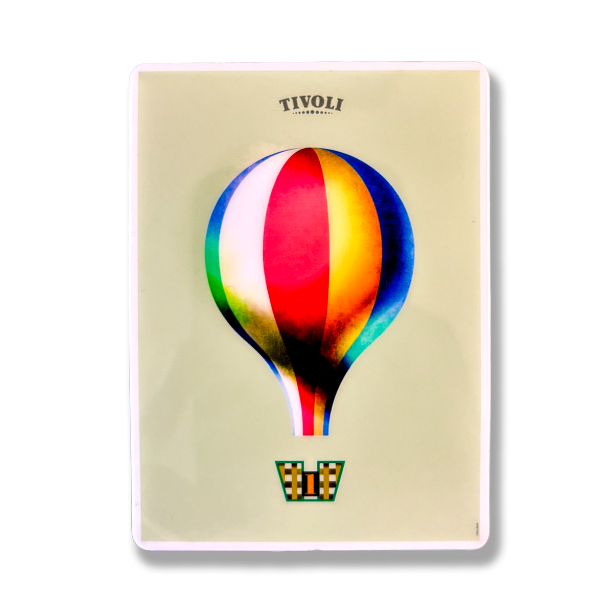 Tivoli magnet med motiv af den ikoniske Tivoli-ballon i røde, blå, gule, grønne og hvide farver. Ballonen svæver over en dekorativ ballonkurv med harlekinmønster og tallet 1 på en lys baggrund med Tivoli-logo øverst.