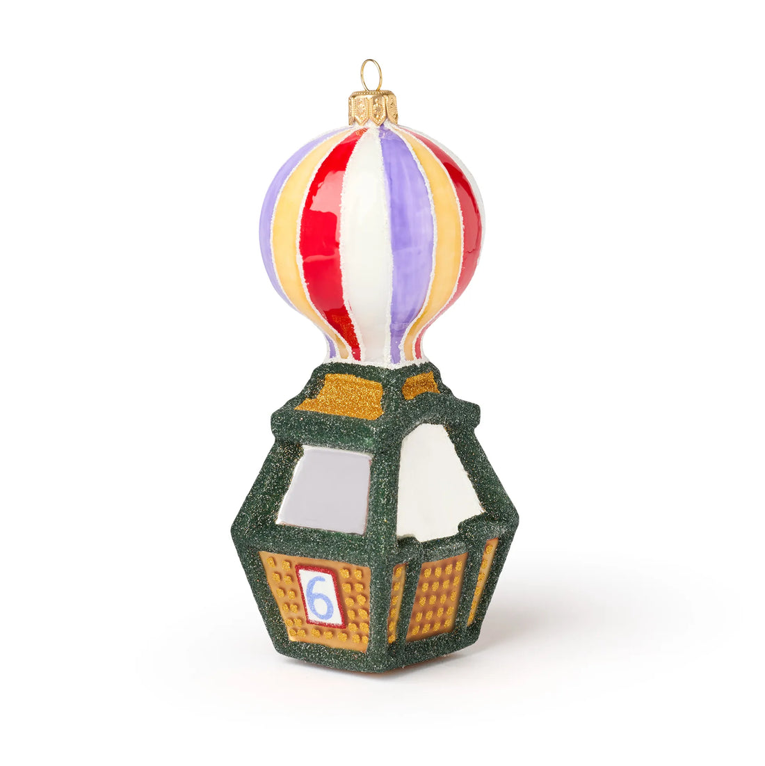 Tivoli Ballongynge julekugle i mundblæst og håndmalet glas. Ornamentet er formet som en klassisk ballon med striber i rød, hvid, lilla og guld over en grøn gondol med guldfarvede detaljer og nummer på siden, inspireret af Tivolis ikoniske Ballongynge.