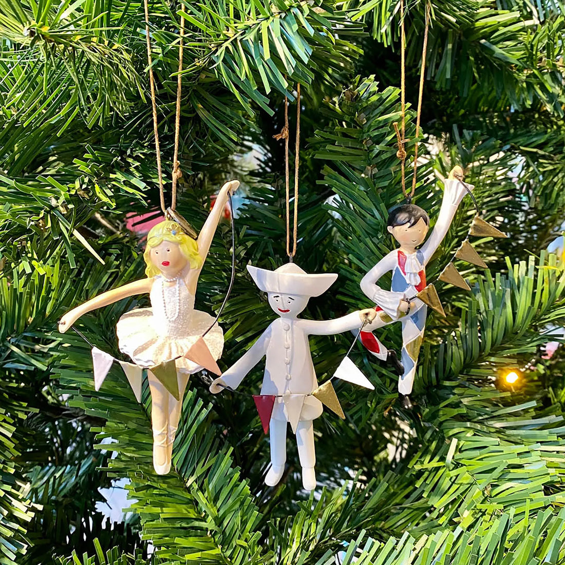 Personalized Pierrot porcelain ornament inspired by Tivoli's Pantomime Theatre and decorated with a festive bunting garland